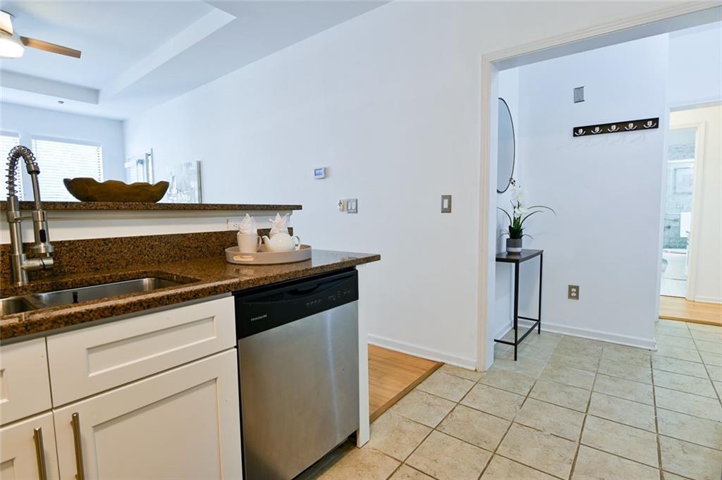 821 Ralph McGill Boulevard Northeast, Unit 2416 Atlanta, GA 30306 - Photo 8 of 44 a kitchen with a stove and a cabinets