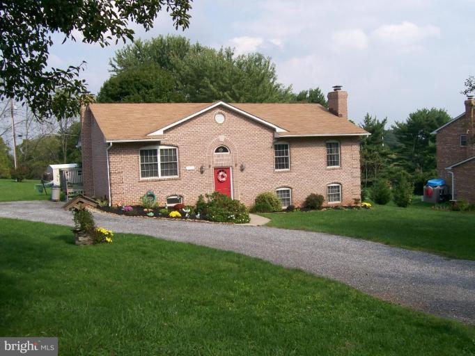2624 Sandymount Road Finksburg, MD 21048 - Photo 1 of 1 a front view of house with yard and green space