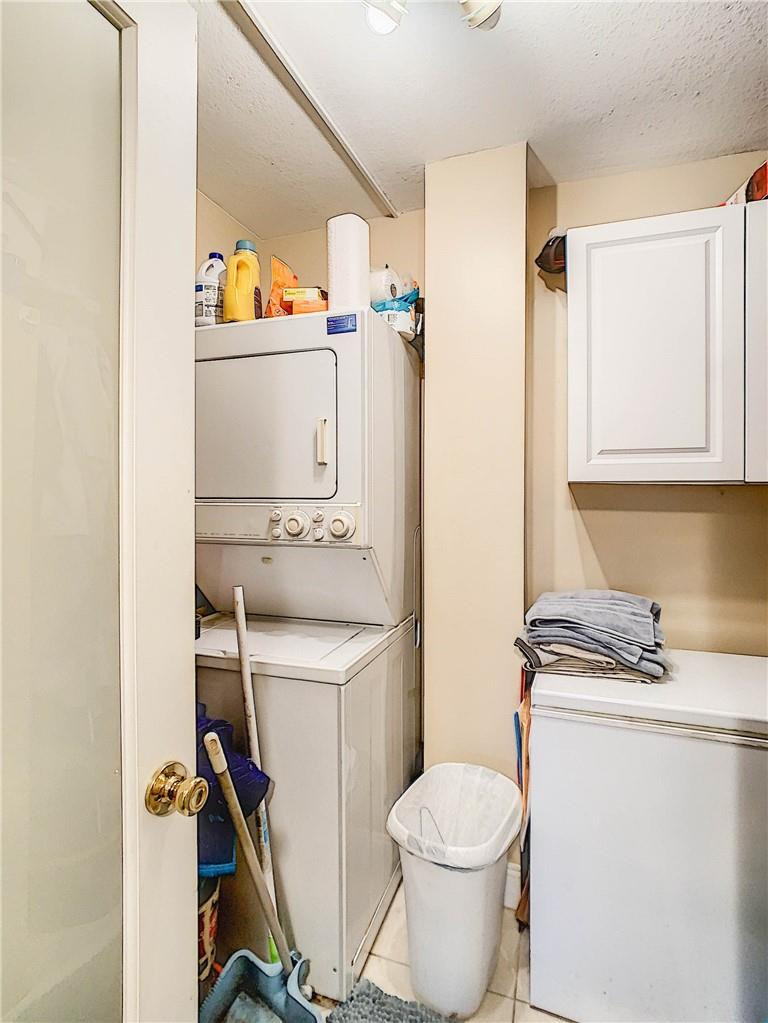 23200 Camino Del Mar, Unit 608 Boca Raton, FL 33433 - Photo 39 of 54 Washer/Dryer and utility room