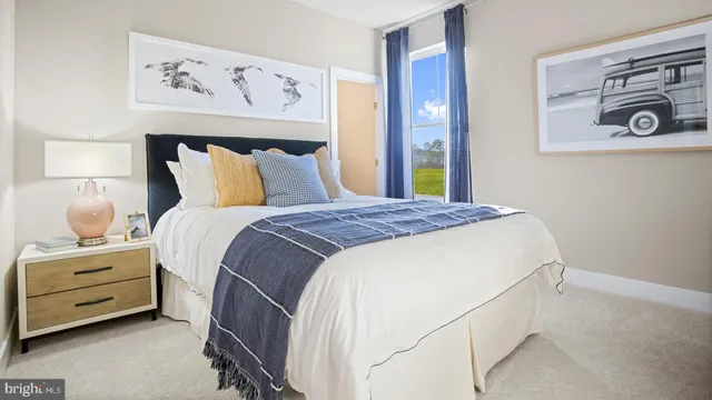 a bedroom with a bed and a night stand