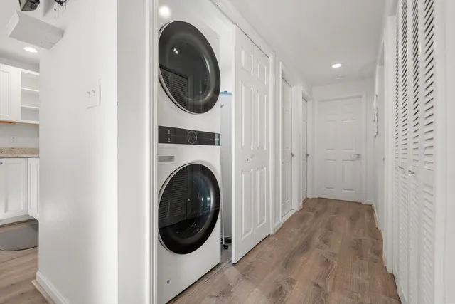 a view of a hallway with washer and dryer