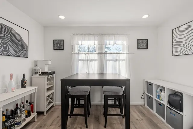 a kitchen with a table and chairs in it