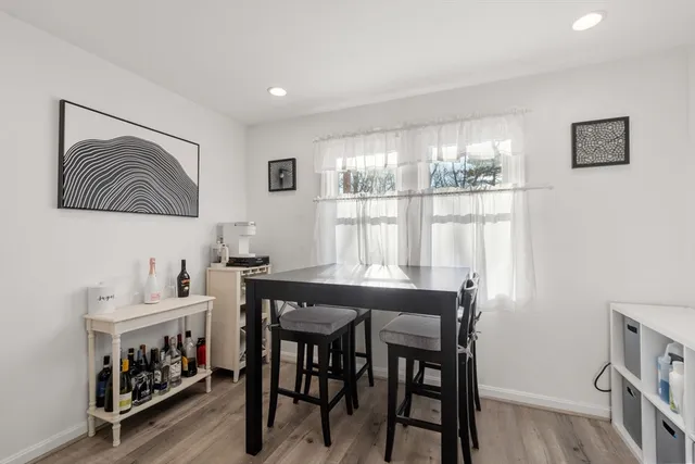 a kitchen with a table and chairs in it