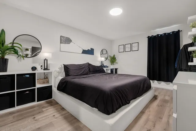 a bedroom with a bed and closet