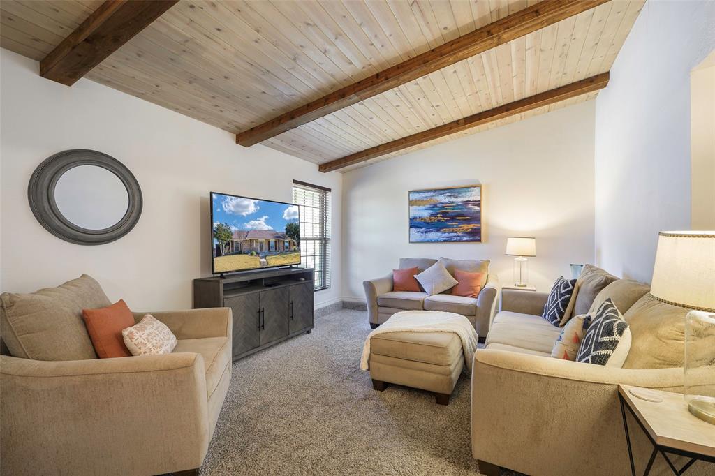 5810 Galaxie Road Garland, TX 75044 - Photo 11 of 33 a living room with furniture and a flat screen tv