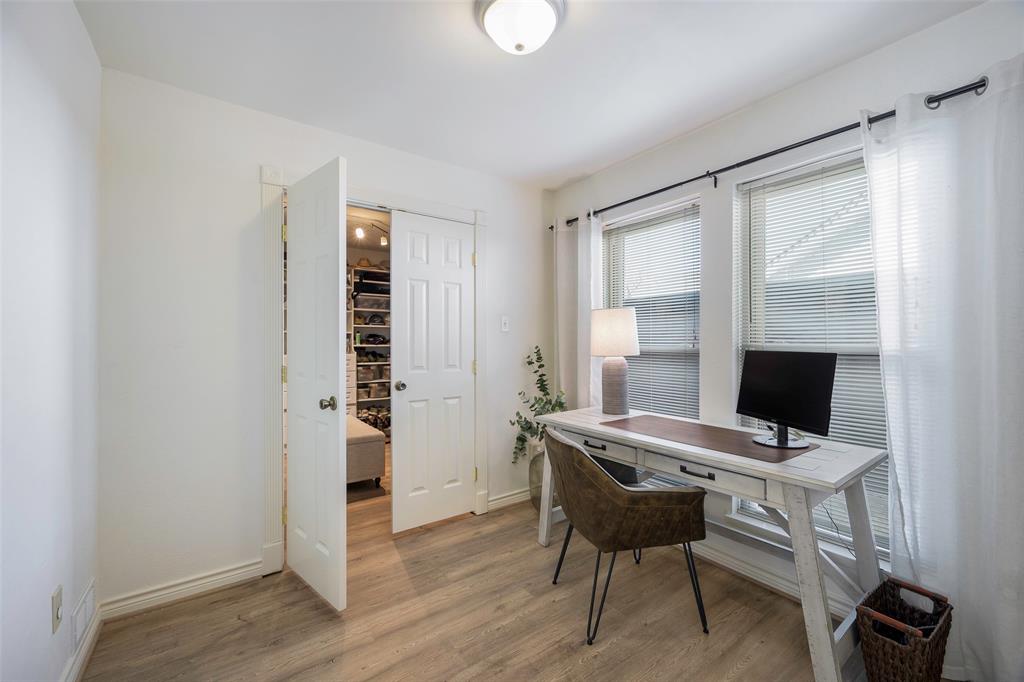 5810 Galaxie Road Garland, TX 75044 - Photo 14 of 33 a view of a workspace with furniture and a window