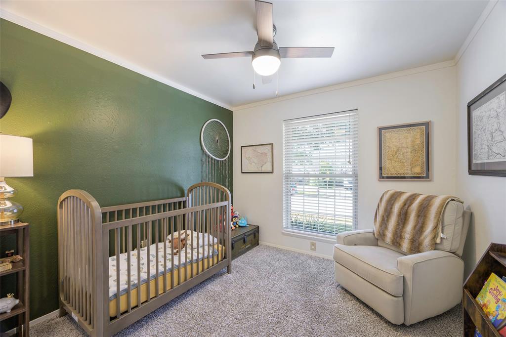 5810 Galaxie Road Garland, TX 75044 - Photo 20 of 33 a bedroom with furniture and a window