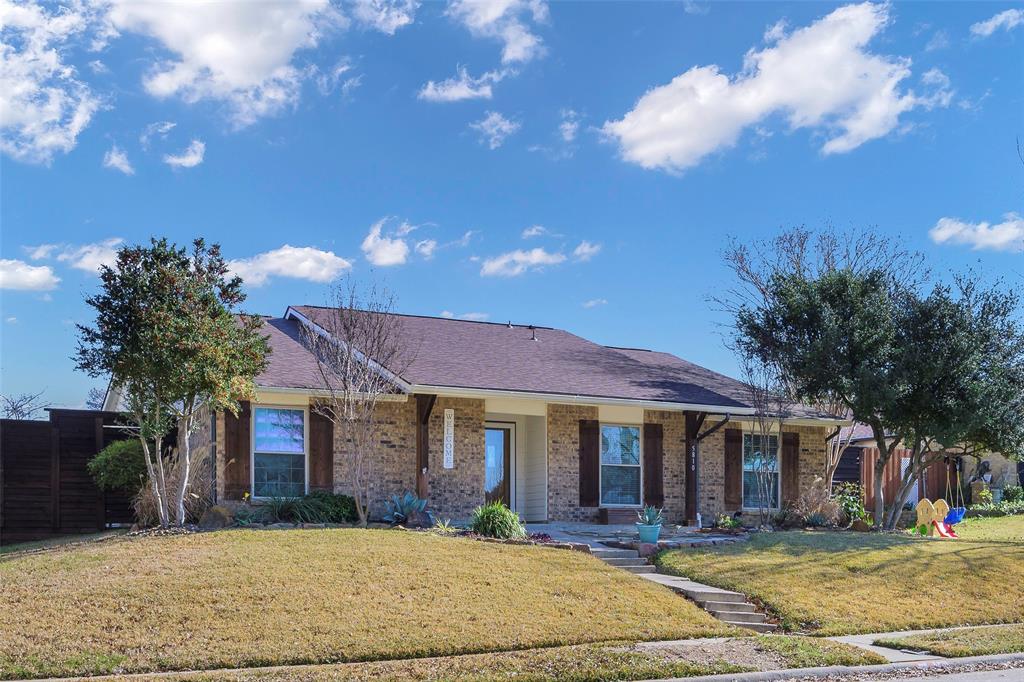 5810 Galaxie Road Garland, TX 75044 - Photo 26 of 33 a front view of a house with a yard fire pit and outdoor seating