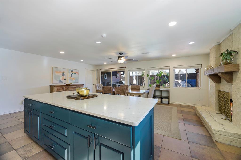5810 Galaxie Road Garland, TX 75044 - Photo 4 of 33 a view of kitchen island a sink and a refrigerator