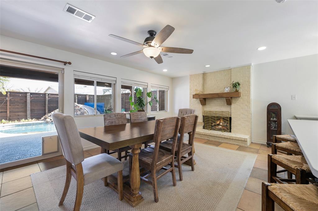 5810 Galaxie Road Garland, TX 75044 - Photo 6 of 33 a view of a dining room with furniture and a chandelier