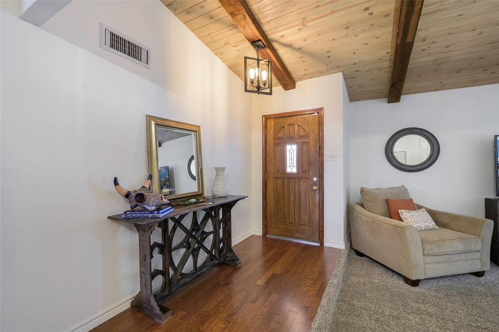 5810 Galaxie Road Garland, TX 75044 - Photo 9 of 33 a living room with furniture and a mirror
