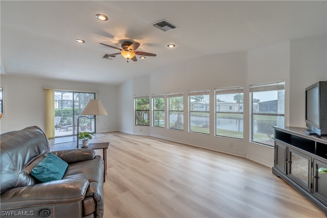 109 Audubon Road Naples, FL 34114 - Photo 11 of 41 a living room with furniture fireplace and flat screen tv