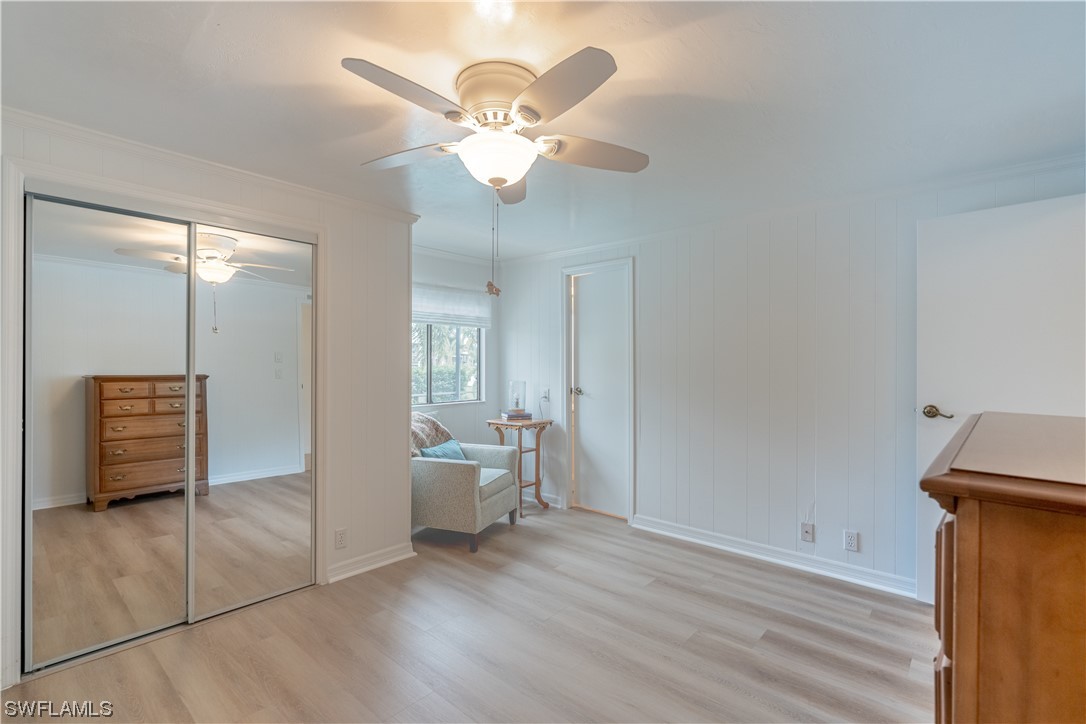 109 Audubon Road Naples, FL 34114 - Photo 15 of 41 wooden floor in an empty room with a mirror