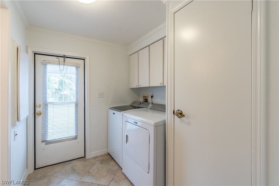 109 Audubon Road Naples, FL 34114 - Photo 18 of 41 a view of a utility room with closet dryer and washer