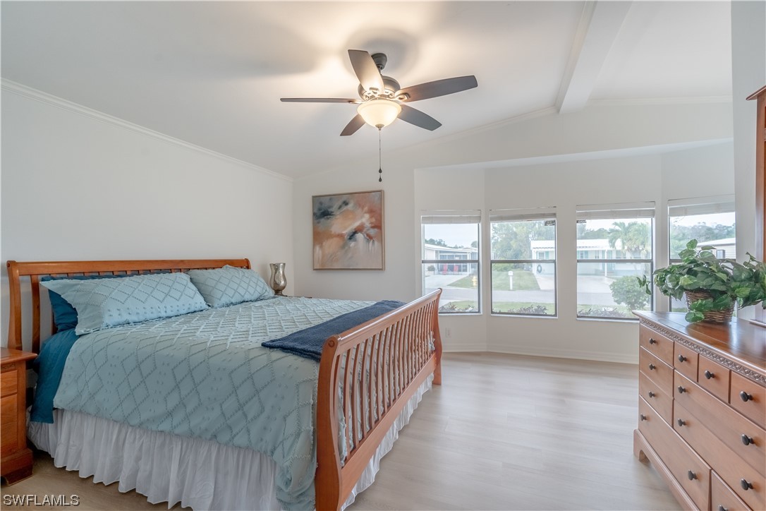 109 Audubon Road Naples, FL 34114 - Photo 19 of 41 a bed room with a bed and a large window