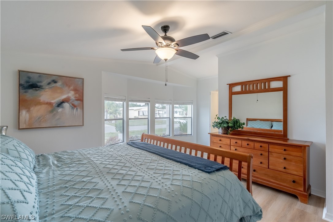 109 Audubon Road Naples, FL 34114 - Photo 20 of 41 a bedroom with a large bed and a window