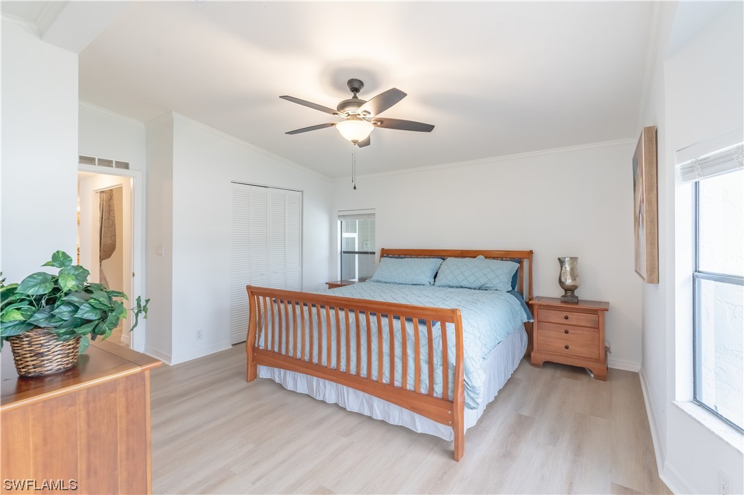 109 Audubon Road Naples, FL 34114 - Photo 22 of 41 a bedroom with bed and a window