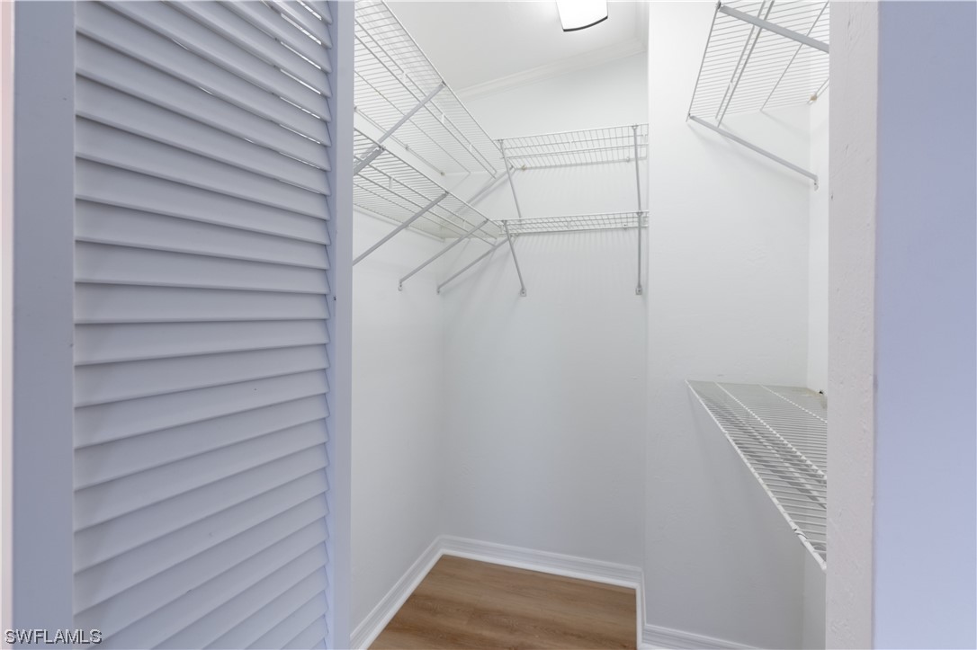 109 Audubon Road Naples, FL 34114 - Photo 23 of 41 a view of a room with racks on the wall