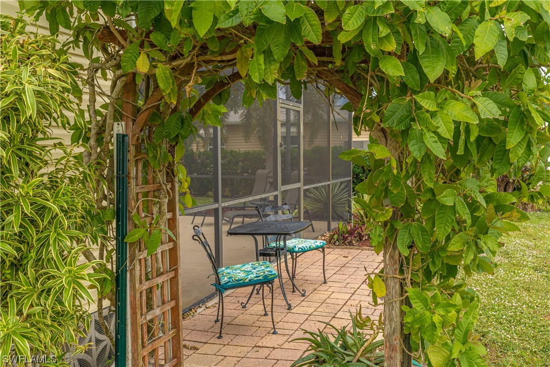 109 Audubon Road Naples, FL 34114 - Photo 33 of 41 a view of an outdoor space with seating area