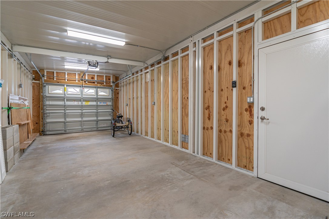 109 Audubon Road Naples, FL 34114 - Photo 34 of 41 a view of an empty room with storage