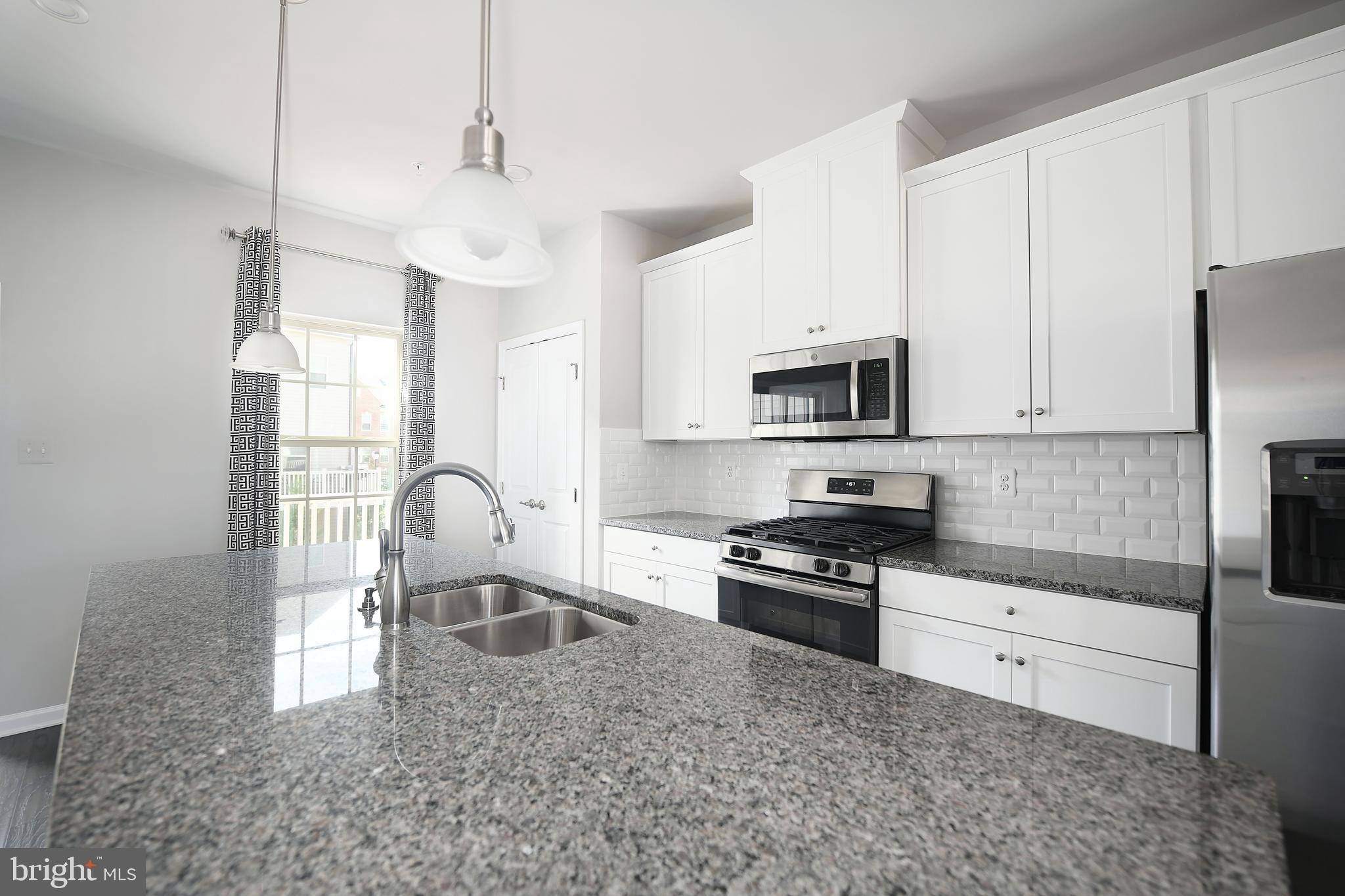 2929 Timberneck Way Hanover, MD 21076 - Photo 13 of 29 Granite Countertops, White Tile Backsplash