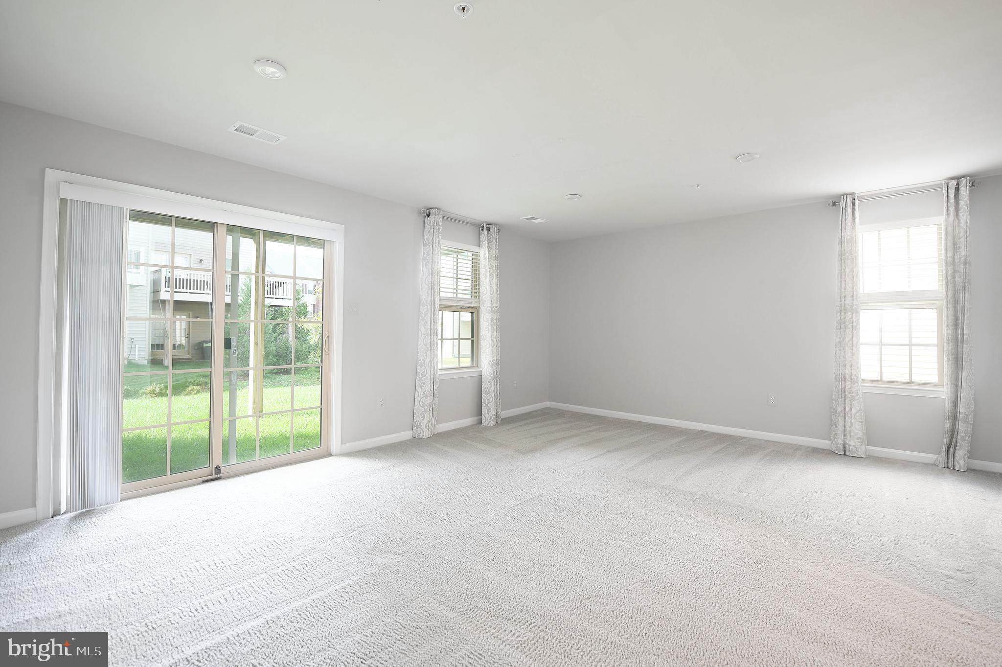 2929 Timberneck Way Hanover, MD 21076 - Photo 7 of 29 Entry-level Family Room Painted in Neutral Colors