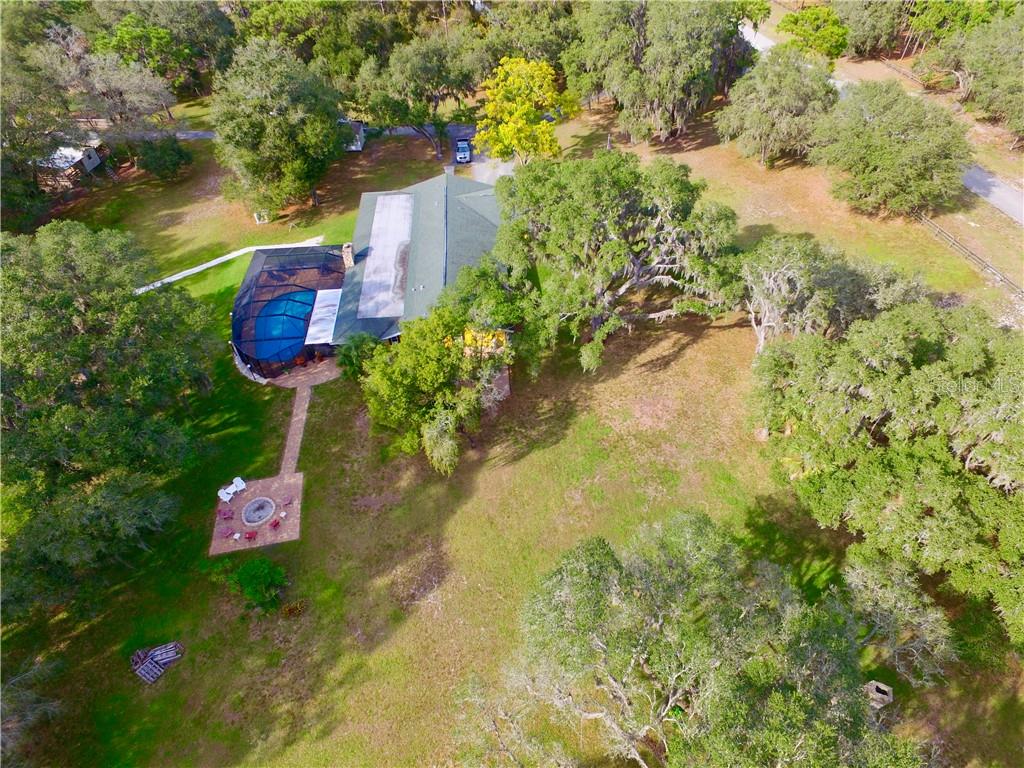 4873 Old Ranch Road Sarasota, FL 34241 - Photo 29 of 49 Aerial, showing the east side of the home with the big fire ring.