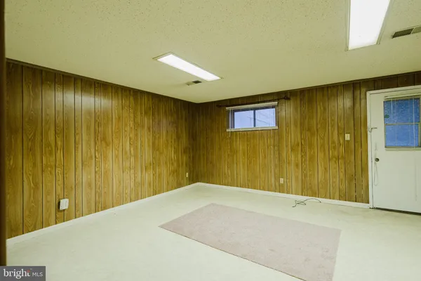 a view of bathroom with a refrigerator
