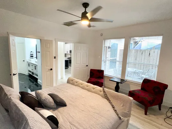 a bedroom with a bed and furniture