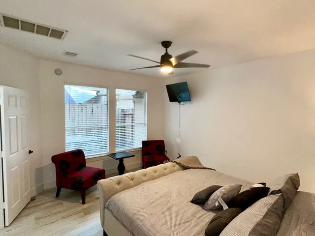 a bedroom with a bed and a couch