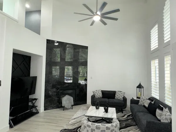 a living room with furniture and a window