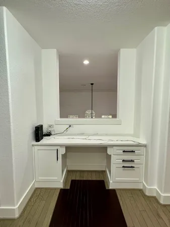 a kitchen with a sink and cabinets