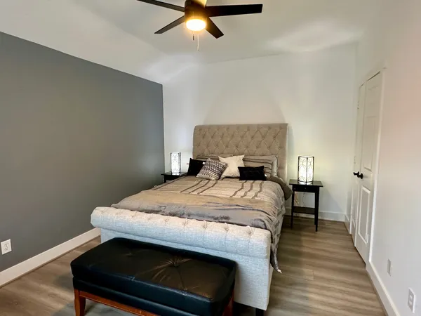 a bedroom with a bed and a table