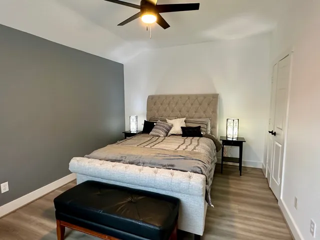 a bedroom with a bed and a table