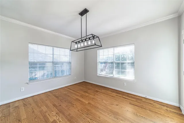 a view of an empty room with windows