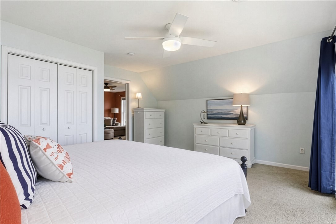 5791 Joy Road Conesus, NY 14435 - Photo 28 of 48 Upper bedroom layout with light-filled windows and ceiling fan.
