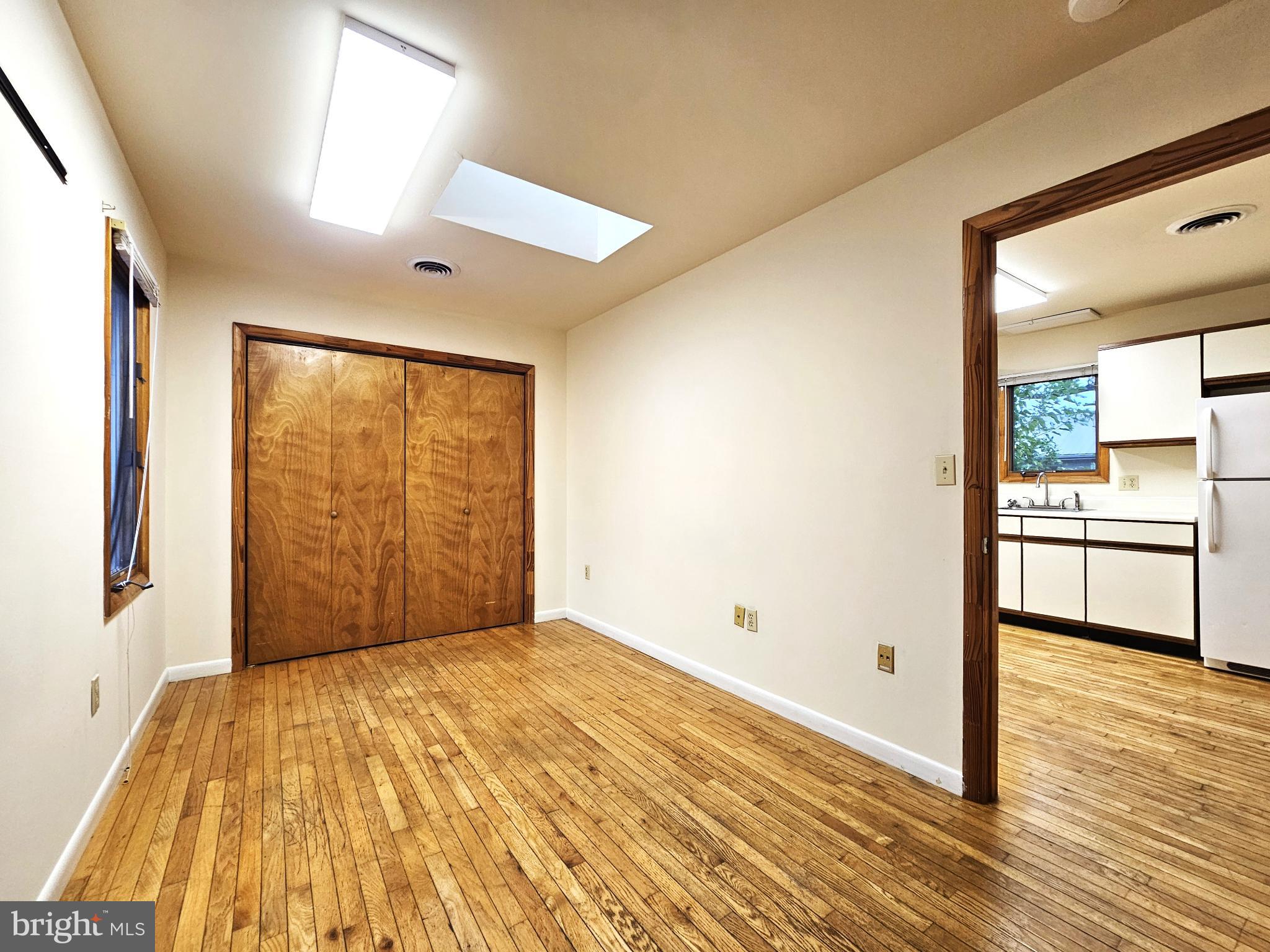 809 Hanson Street, Unit A Salisbury, MD 21801 - Photo 7 of 11 Spacious room with natural light and warmth.