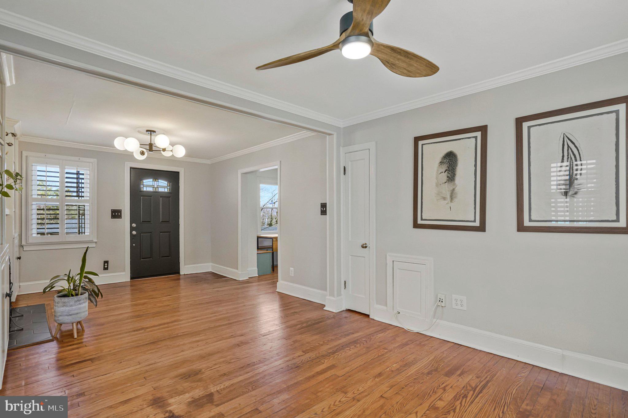 4140 21st Road North Arlington, VA 22207 - Photo 9 of 30 a view of an empty room with wooden floor and a ceiling fan