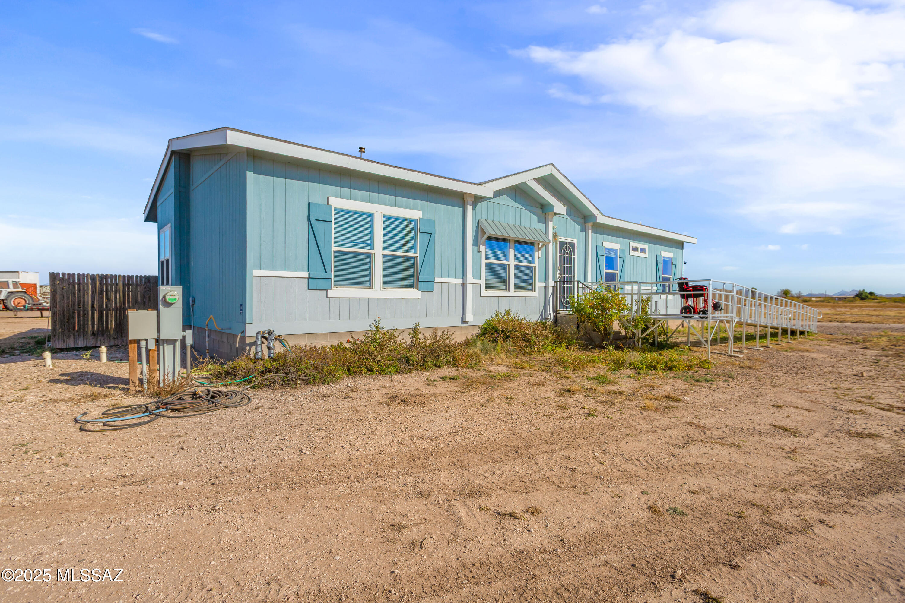 10187 North Mormon Road Elfrida, AZ 85610 - Photo 45 of 50 a front view of a house with garden