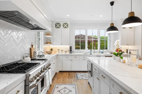 a kitchen with a sink stove and window