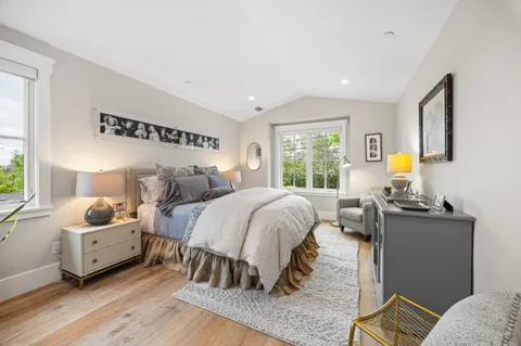 a bed room with a bed and a couch