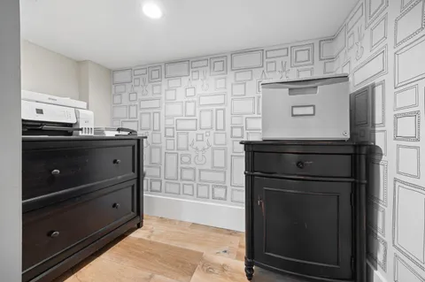 a kitchen with stainless steel appliances granite countertop a stove and a refrigerator