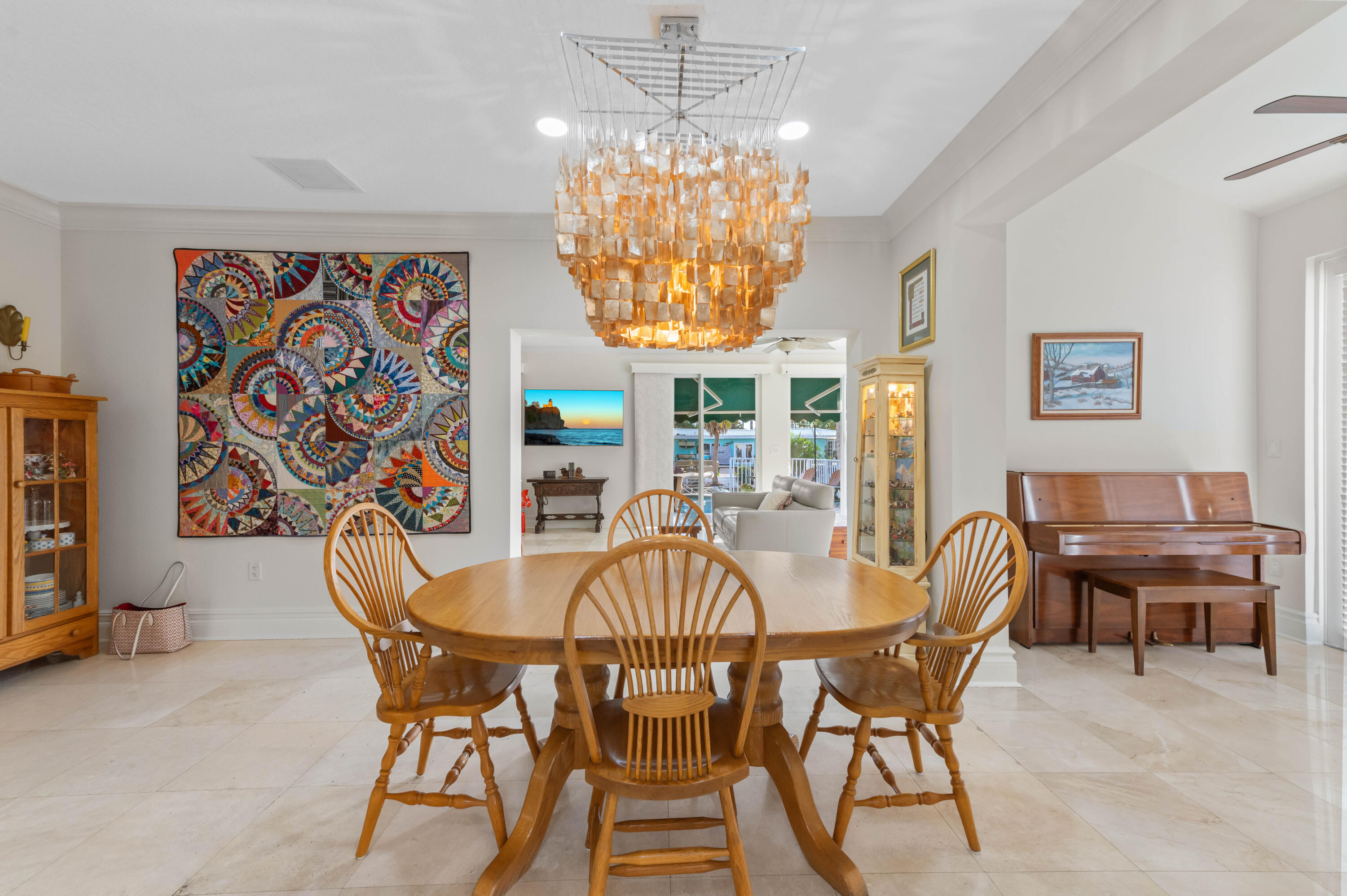 746 West Palmetto Park Road Boca Raton, FL 33486 - Photo 13 of 60 a view of a dining room with furniture a chandelier and a window