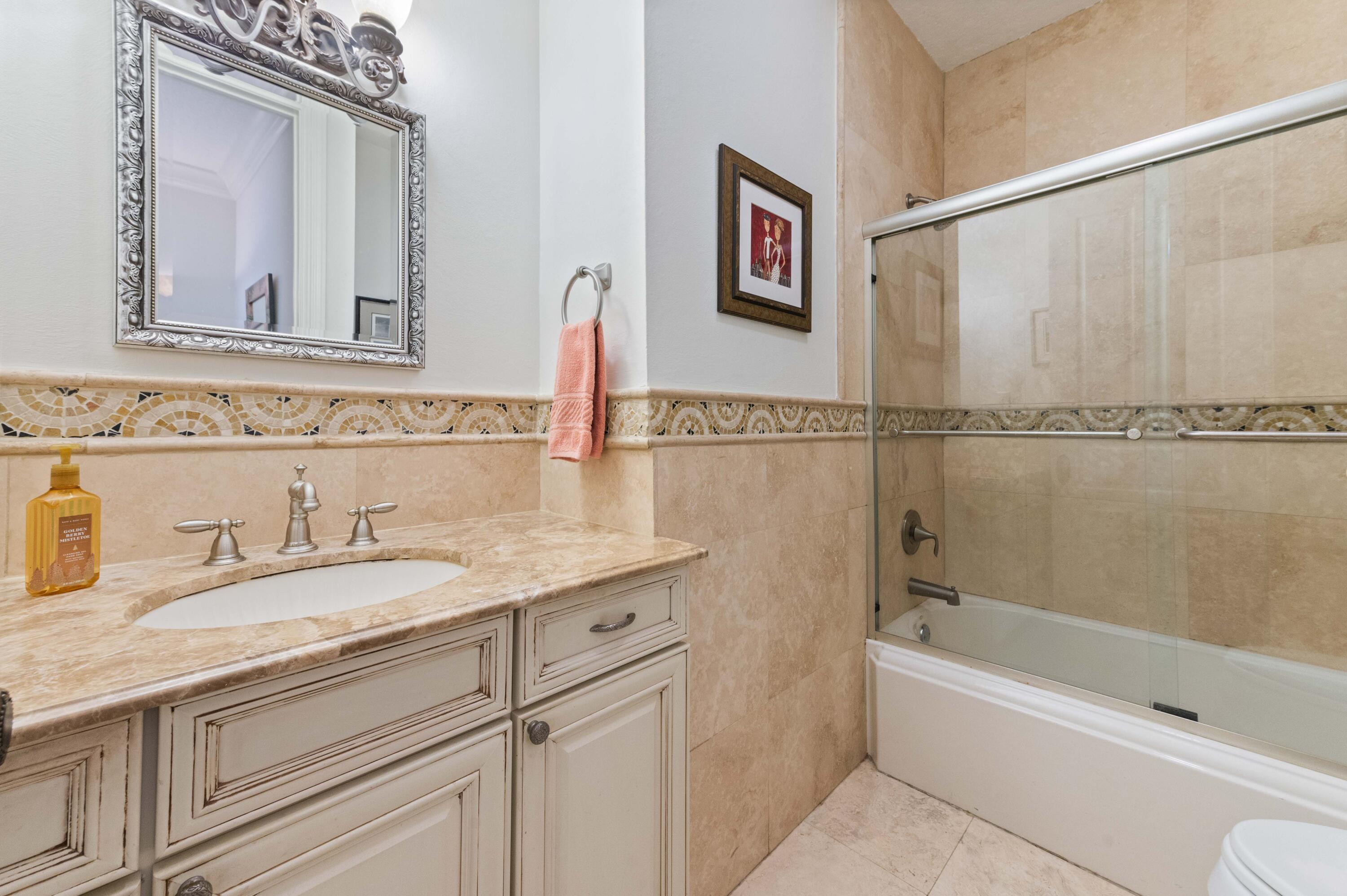 746 West Palmetto Park Road Boca Raton, FL 33486 - Photo 34 of 60 a bathroom with a granite countertop sink mirror toilet and bathtub