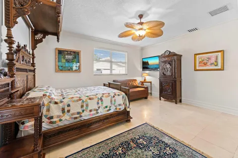 a view of a patio with a table and chairs under an umbrella