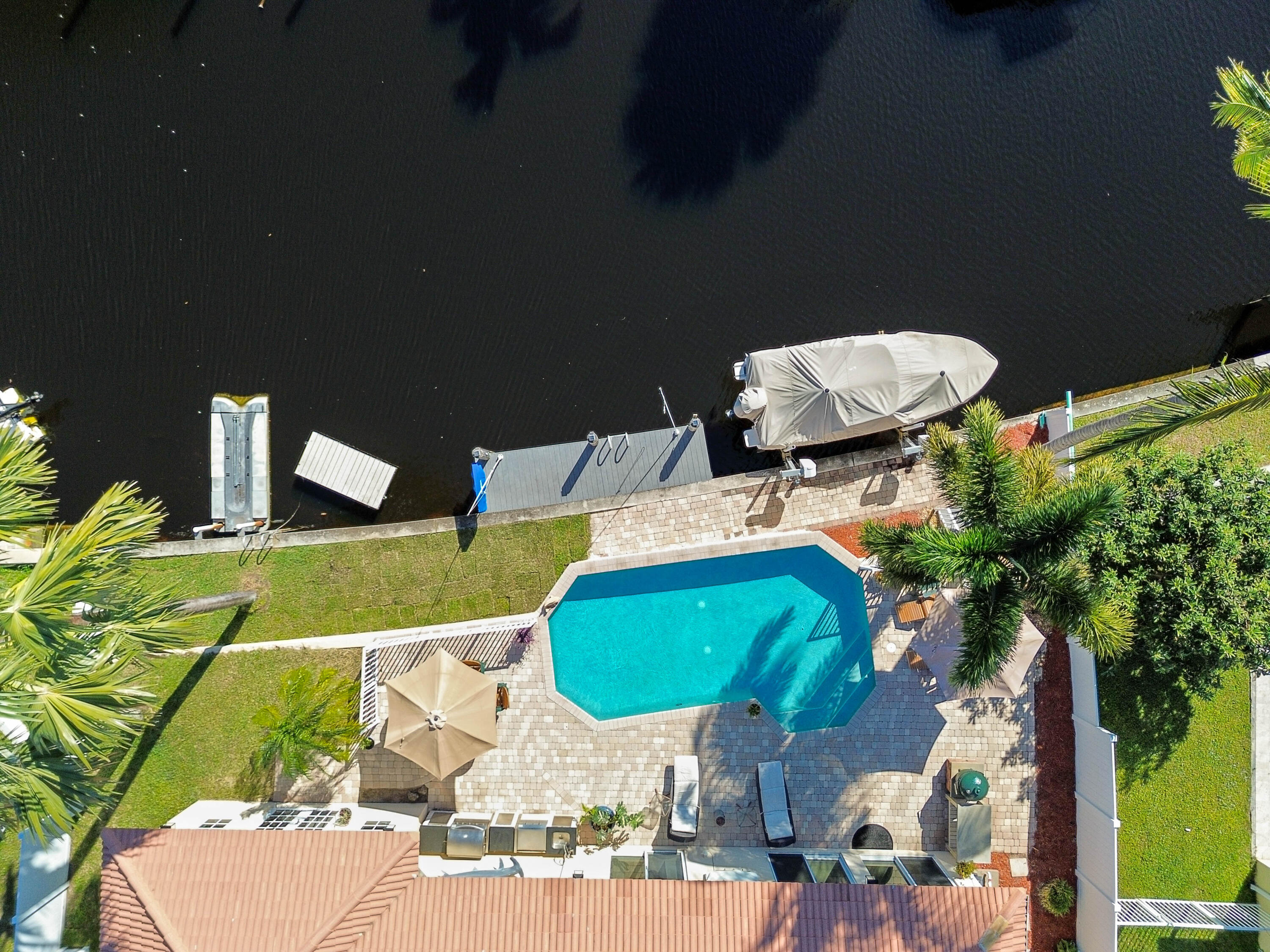 746 West Palmetto Park Road Boca Raton, FL 33486 - Photo 52 of 60 an aerial view of a house with a swimming pool patio and outdoor seating