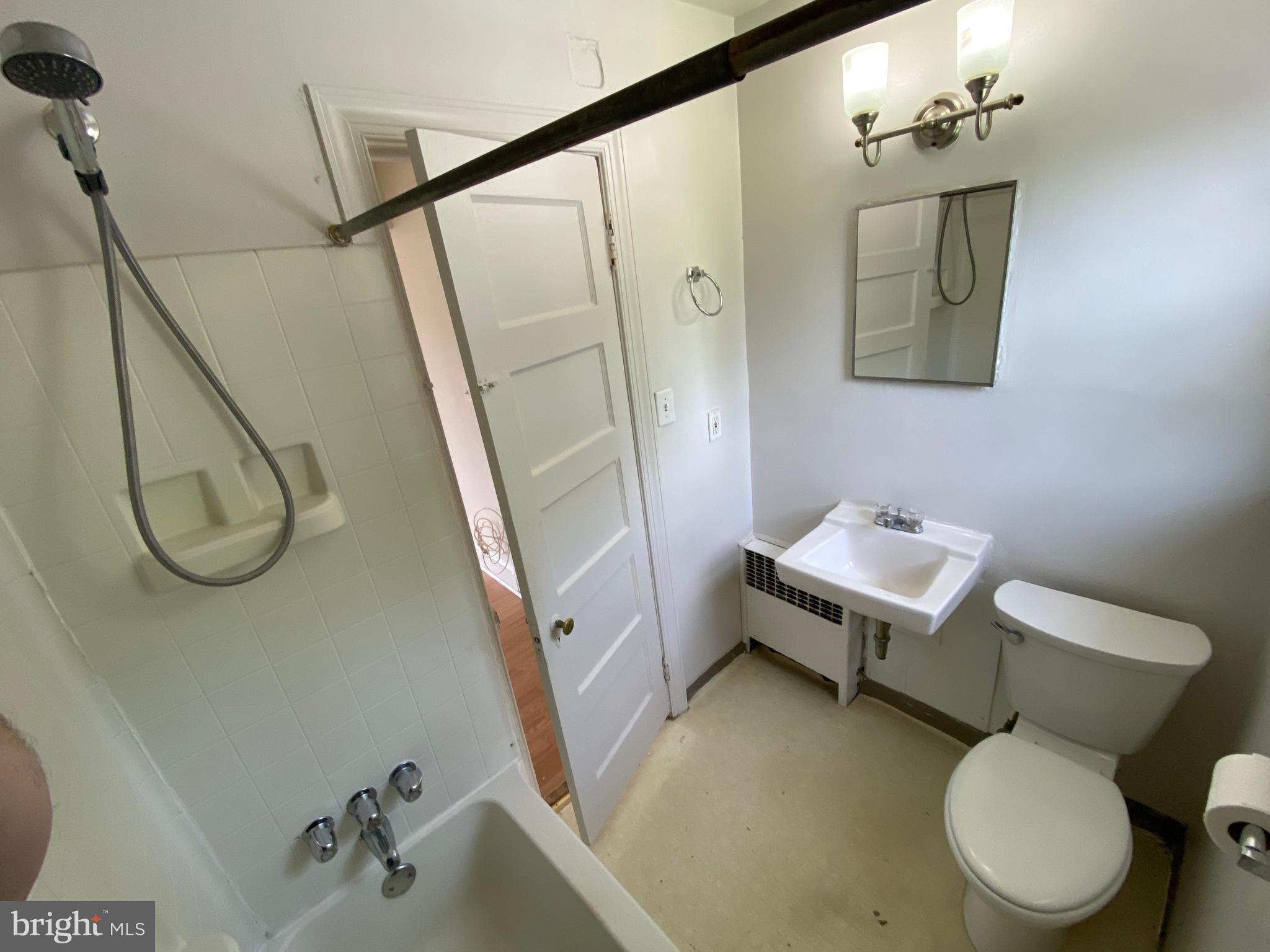 1003 Kenmore Avenue, Unit 3 Fredericksburg, VA 22401 - Photo 16 of 16 a bathroom with a toilet sink and mirror