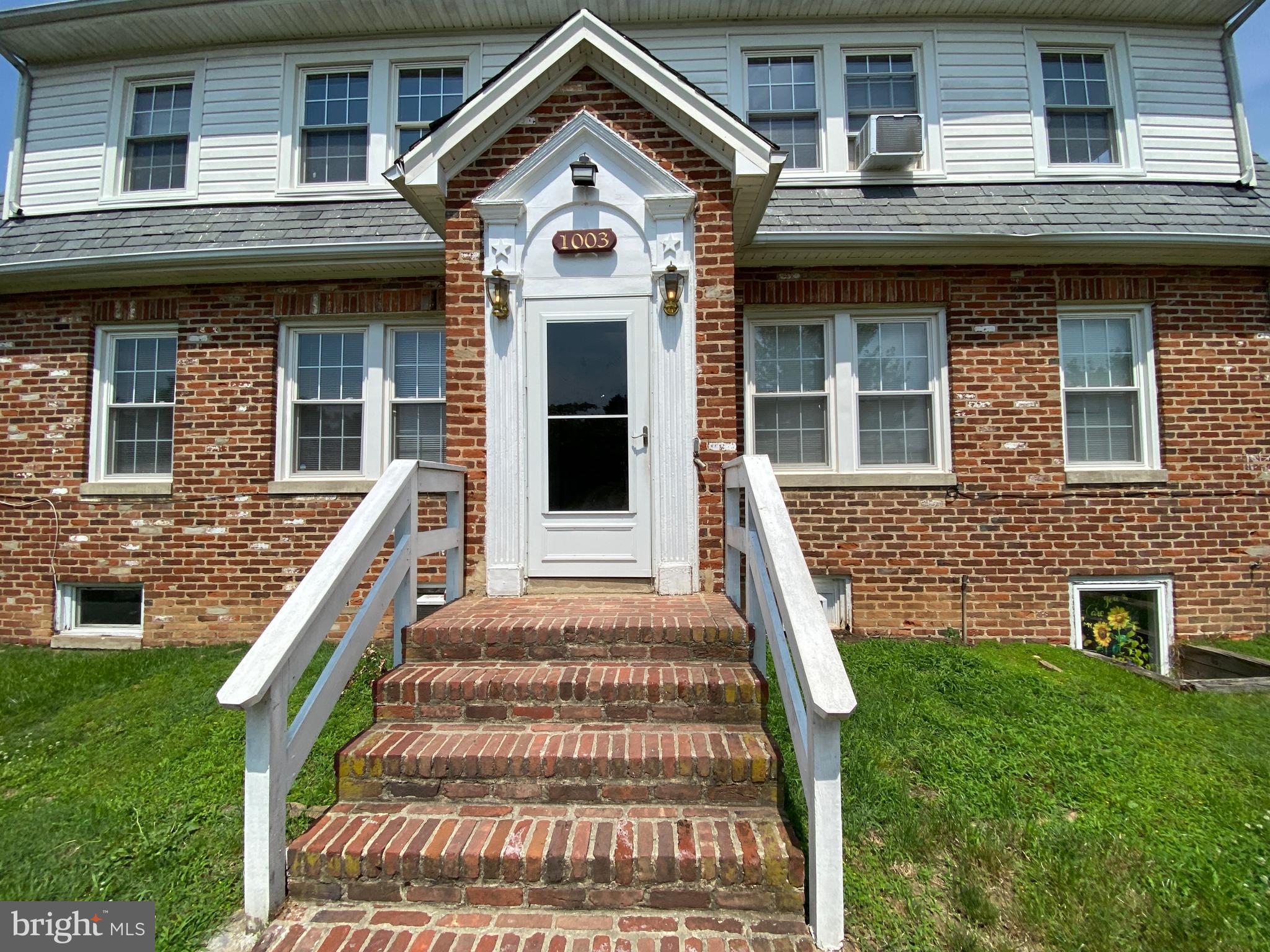 1003 Kenmore Avenue, Unit 3 Fredericksburg, VA 22401 - Photo 2 of 16 a front view of a house with a yard