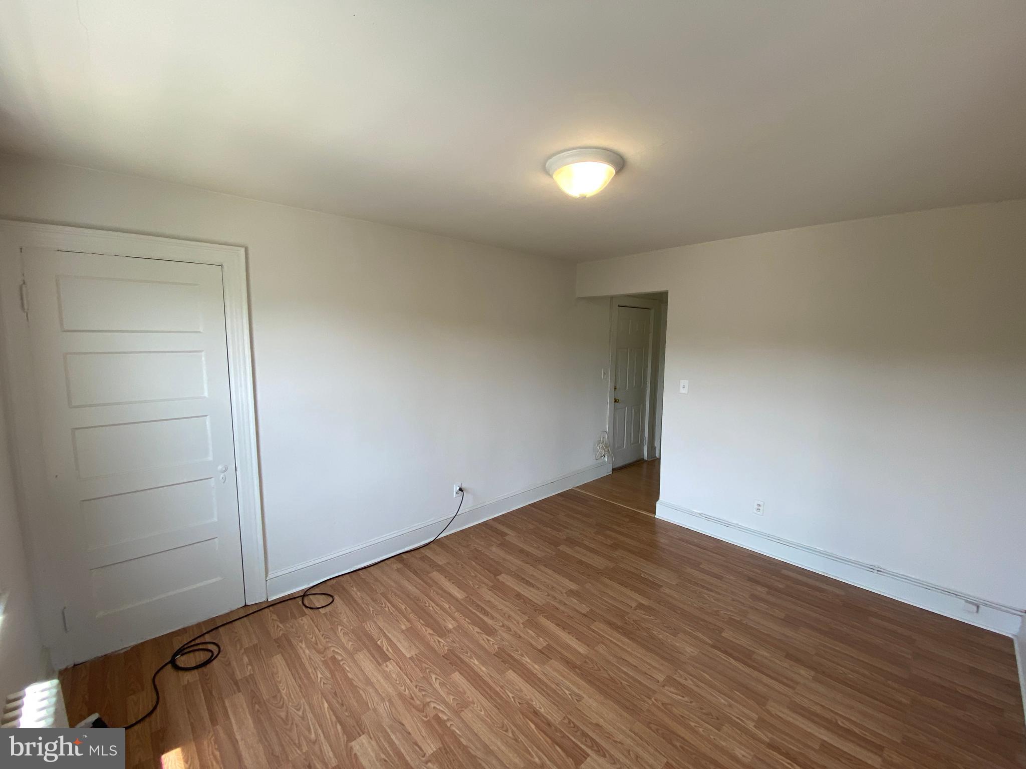 1003 Kenmore Avenue, Unit 3 Fredericksburg, VA 22401 - Photo 6 of 16 an empty room with wooden floor