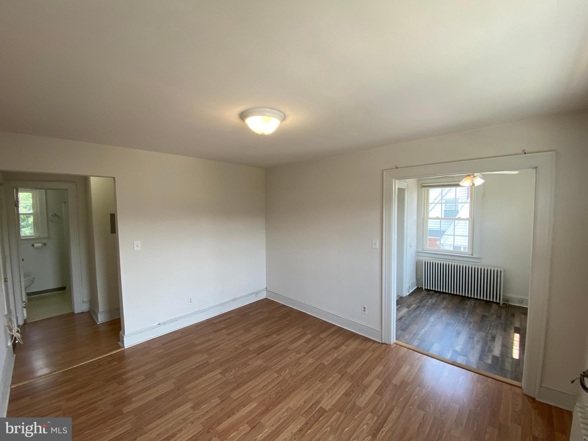 1003 Kenmore Avenue, Unit 3 Fredericksburg, VA 22401 - Photo 7 of 16 wooden floor in an empty room with a window